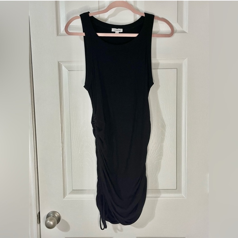Black ribbed sleeveless cinched bodycon dress
